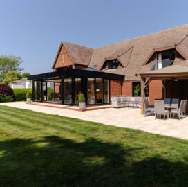 View of the patio from the lawn Porcelain Patio, Watlington. New Driveway Company