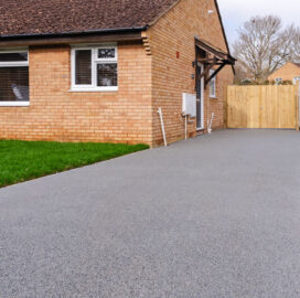 Resin bound driveway in Surrey Silver, new front lawn turfing, and gate Resin Bound Driveway and Porcelain Patio, Abingdon. New Driveway Company