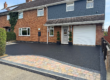 Ruthland Raven resin driveway with block paving design