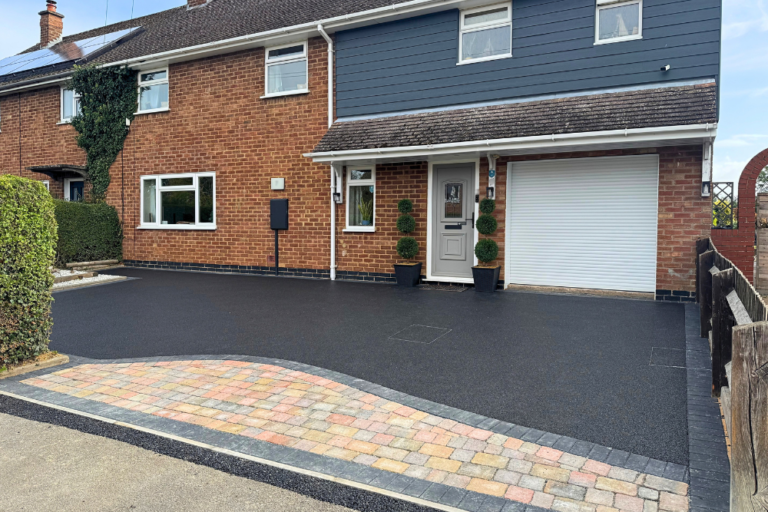 Ruthland Raven resin driveway with block paving design