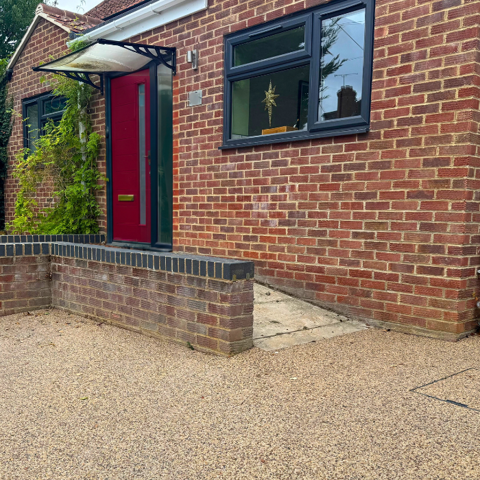 Resin driveway with ramp up to front door